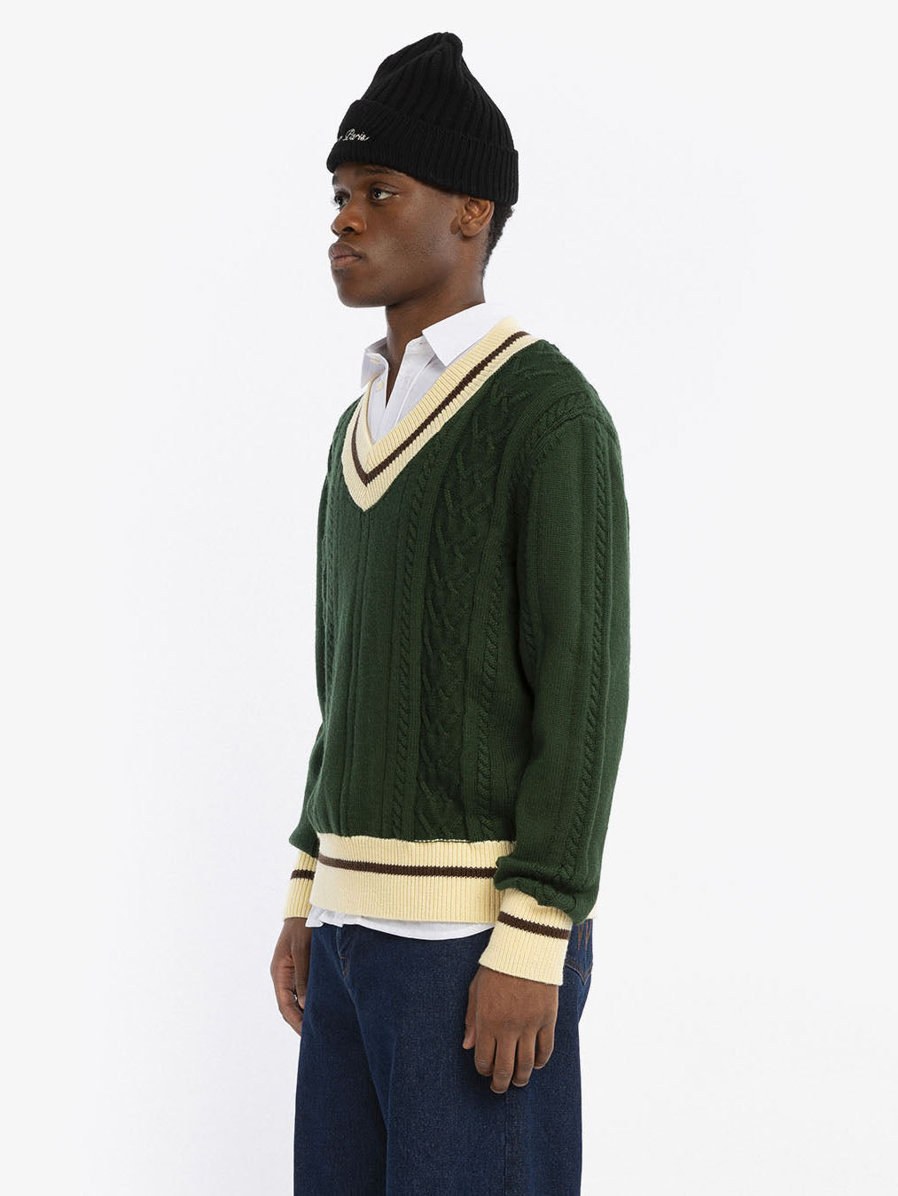 Le pull en maille vert