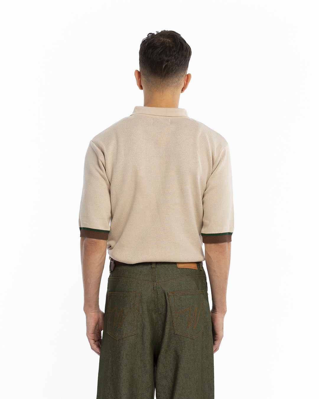 The beige knit polo shirt