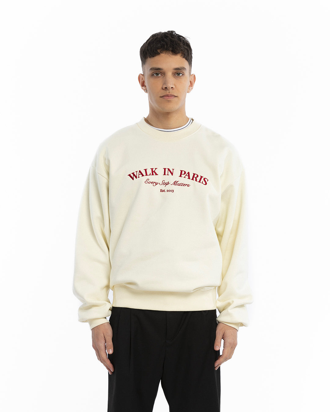 The beige sweatshirt